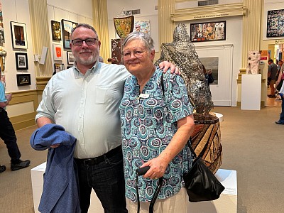 Cadmus withe the Judge, Jeff Bell, Executive Director of NC arts Council with winning piece in background